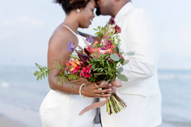 istock African American couple getting married at the beach 1023552946