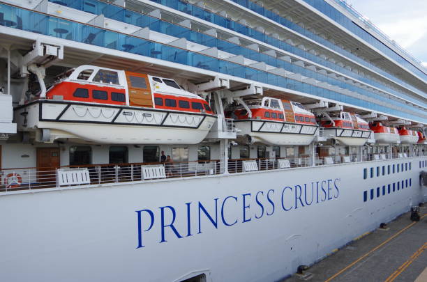 Yokohama, Japan - August 15, 2018: It is a Ōsanbashi Pier of Yokohama Port. A big luxury liner is anchored.The name of the ship is ’Diamond Princess’. She sails under British colours. There are lots of lifeboats lining up.