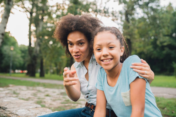 istock Mother and daughter sitting and hugging 1023562250