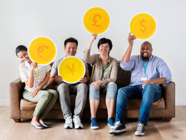 istock Diverse workers sitting and holding currency icons 1023562934