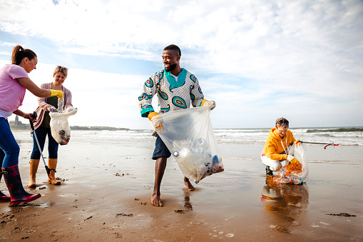 Free Stock Photo of Group of diverse volunteers with garbage bags ...