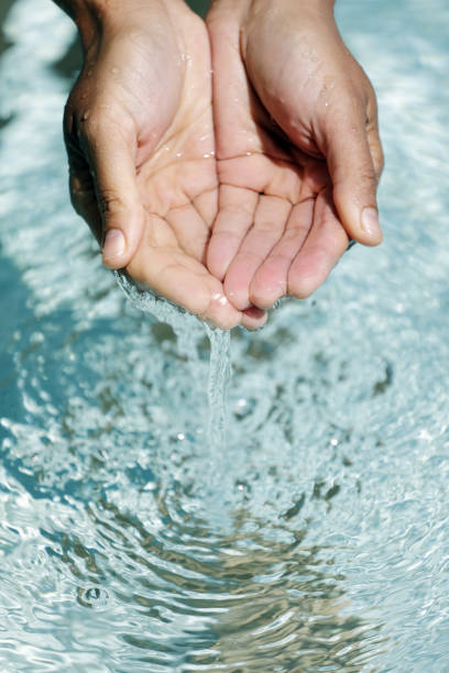 istock Clear water in woman hands 1023578396