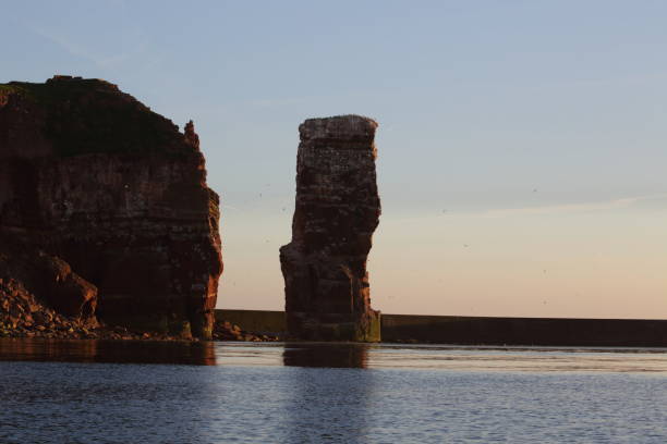 istock Sunset on the rocky coast, sunset on Helgoland in Germany 1023579644