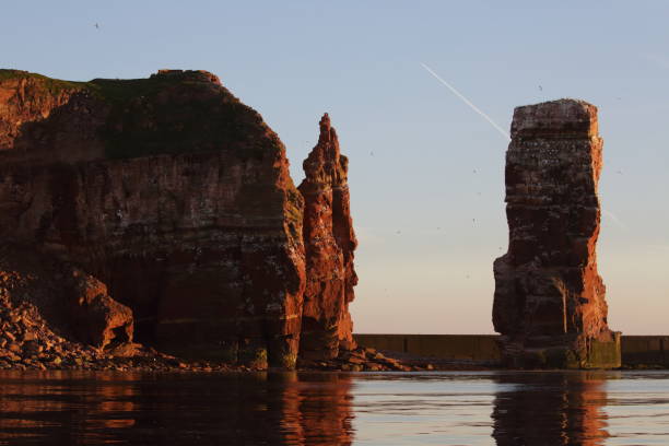 istock Sunset on the rocky coast, sunset on Helgoland in Germany 1023583538