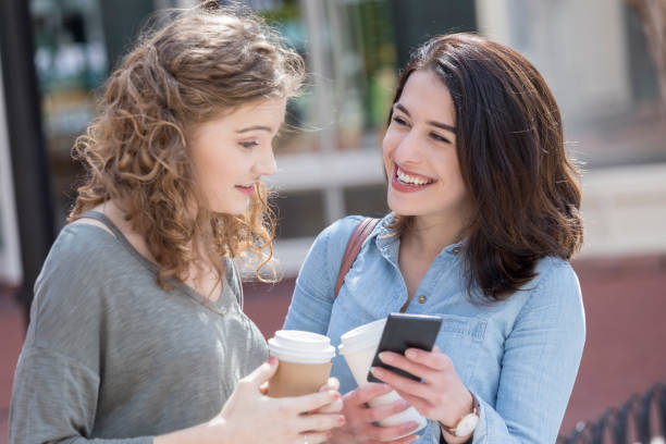istock College students share social media and coffee on campus 1023588268