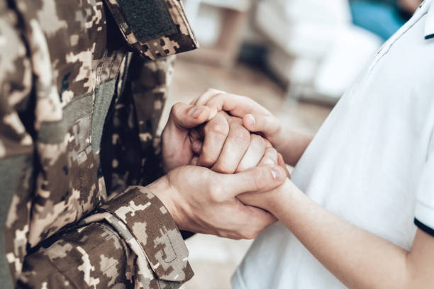 A Man Goes To Military Service. Family Goodbye. A Man Goes To Military Service. Saying Goodbye. Leaving To Army. Farewell With Family. Camouflage Uniform. Son Hanging. Feelings Showing. Guard Of Peace. Patriotic Decision. Soldier Emotion. female combat soldier stock pictures, royalty-free photos & images