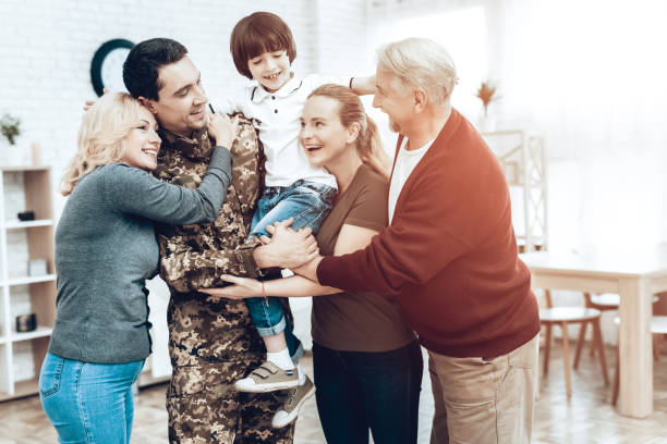 A Man Returns From The Military. Family Meeting. A Man Returns From The Military Service. Family Meeting. Leaving From War. Embrace With Family. Camouflage Uniform. Family Hanging. Feelings Showing. Patriotic Comeback. Soldier Emotion. proud army mom stock pictures, royalty-free photos & images