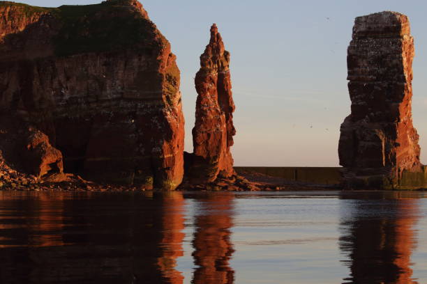 istock Sunset on the rocky coast, sunset on Helgoland in Germany 1023593000