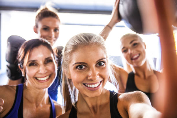 istock Fitness friends having a break with selfie post workout 1023593034