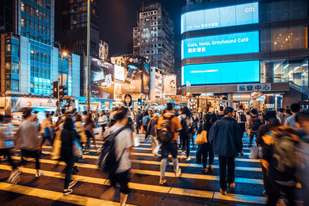 istock People Rush in Hong Kong, China at night 1023596936