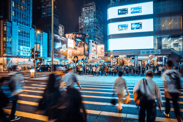 istock People Rush in Hong Kong, China at night 1023597020