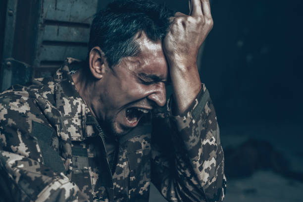 istock Soldier Is Sitting In War Shelter With Cigarette. 1023597102