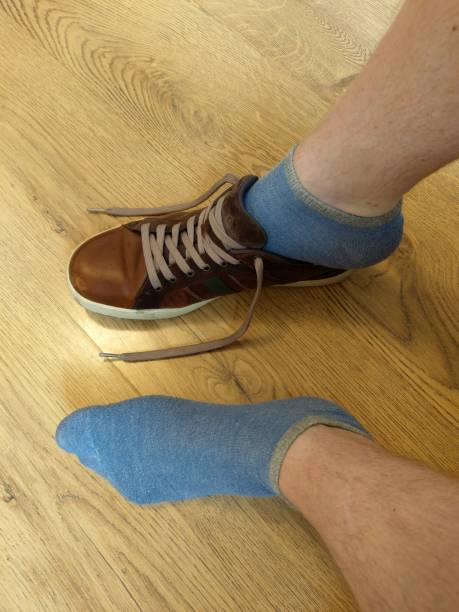 istock Putting on shoes with short socks 1023597632