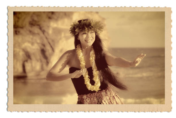 Retro 1940s-50s Vintage Style Hawaiian Hula Dancer Postcard Old Photo A retro old vintage style photo postcard look of a beautiful Hawaiian Hula dancer dancing on the beach of the tropical Hawaiian islands. Photographed in horizontal format with copy space in Kauai, Hawaii. polynesia photos stock pictures, royalty-free photos & images