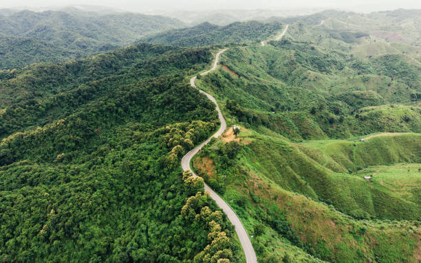 istock Asphalt curved highway on mountain 1023603202