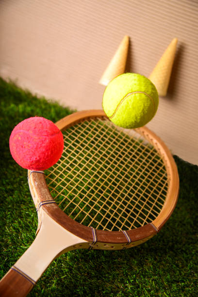 istock Tennis racket on green grass 1023603252