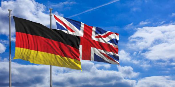 istock England and Germany waving flags on blue sky. 3d illustration 1023605146