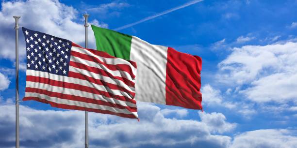 istock Italy and America waving flags on blue sky. 3d illustration 1023605306