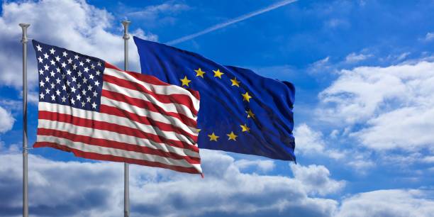 istock EU and America waving flags on blue sky. 3d illustration 1023607406