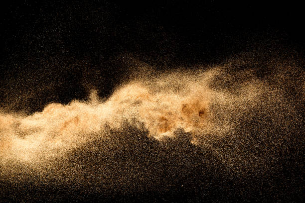 istock Dry river sand explosion. Golden colored sand splash against dark background. 1023607734