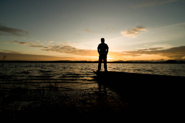 istock standing on old fishing boat 1023611212