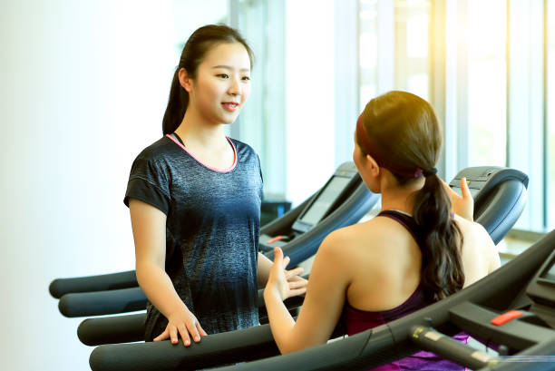 istock Private female coach is teaching one-on-one teaching girl treadmill 1023611870
