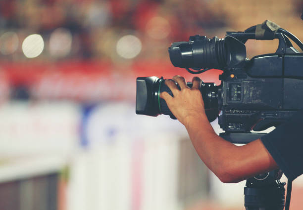 istock Soft focus and blurry of Professional cameraman and Video camera operator working with his professional equipment 1023611892