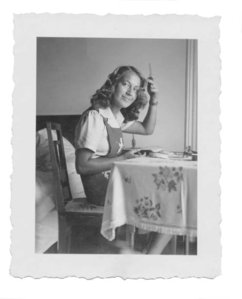 istock 1941,Beautiful young woman combing her hairs 1023615544