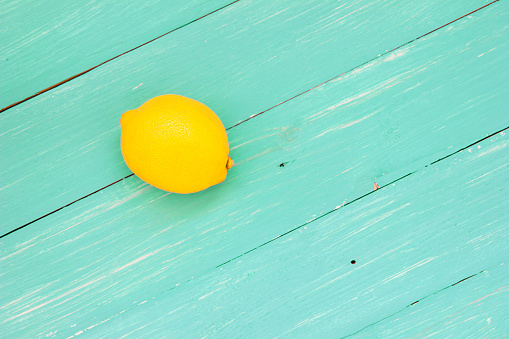 Fresh lemon on turquoise boards