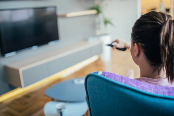 istock Woman watching TV 1023615850