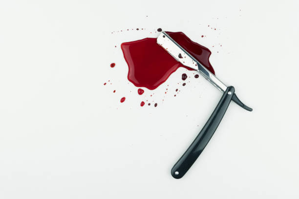 istock a bloody vintage straight razor 1023616064