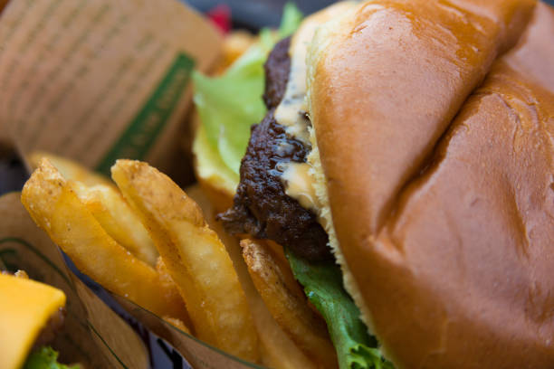 istock Delicious fresh burger close up. Selective focus with shallow depth of field 1023616670