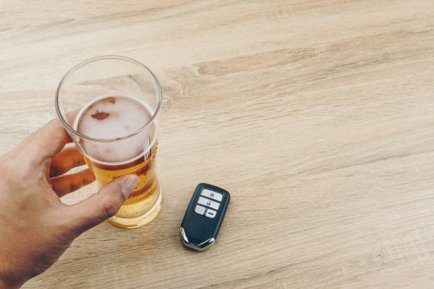 istock hand holding a glass of beer 1023617906