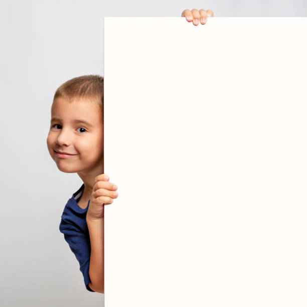 istock White billboard with smiling child on the side 1023628312