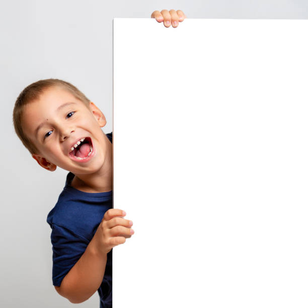 istock White billboard with smiling child on the side 1023628314