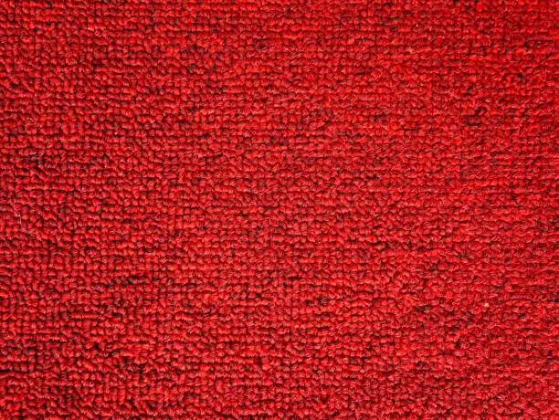 Photo of Elegance red color carpet texture background