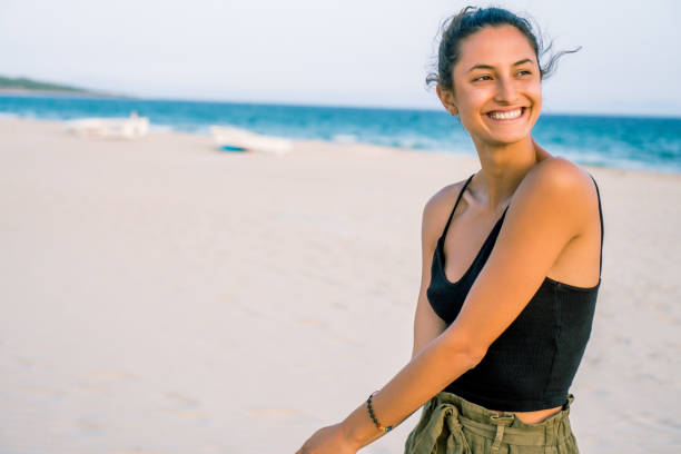istock Beautiful woman walking on the beach. 1023634712
