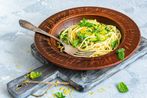 istock Pasta with cream sauce, zucchini and lemon zest. 1023635312