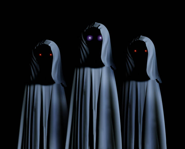 istock Three spooky monsters in hooded cloaks with glowing eyes 1023642780