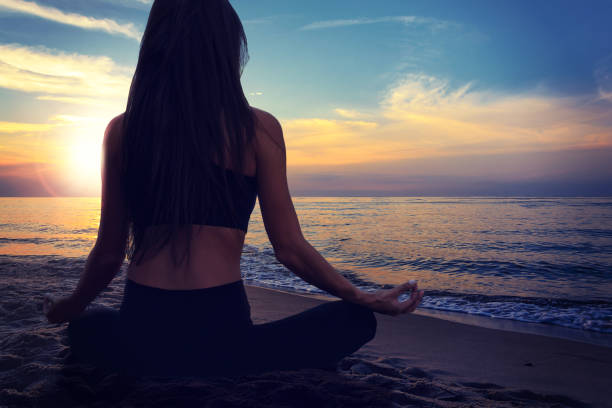 istock Beautiful woman meditating 1023645268