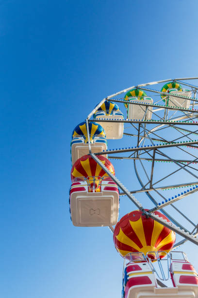 istock fragment of a ferris wheel on a blue sky background 1023652828