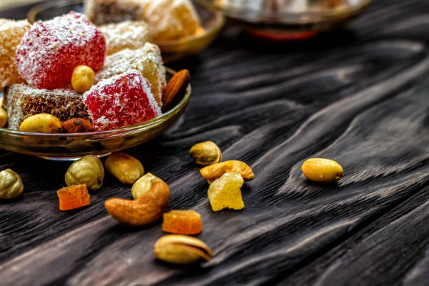 istock oriental sweets, lukum and nuts on a dark wooden background. Top view, copy space. Power Background 1023655890