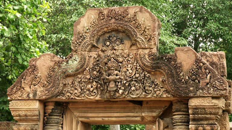 intricately carved stone pediment at banteay srei temple