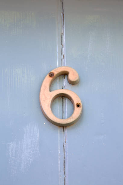 istock Number Six on Grey Door 1023658976