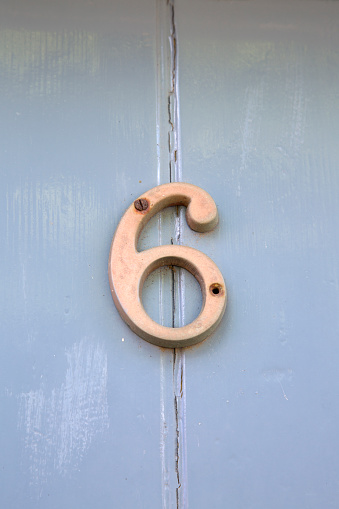 Number Six on Grey Door