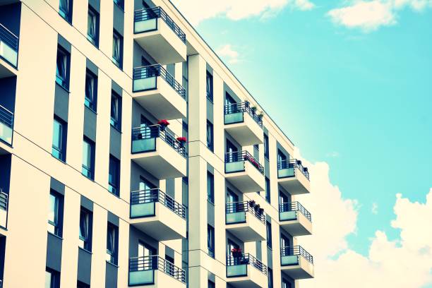 istock Modern apartment building exterior. Retro colors stylization 1023665542