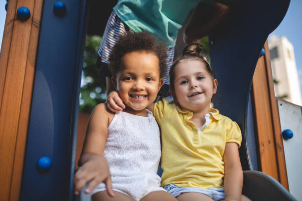 istock Gorgeous toddler friends hugging and smiling together 1023665656
