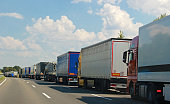 row of trucks on a highway