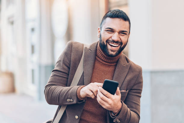 istock Young man with cell phone on the street 1023674726