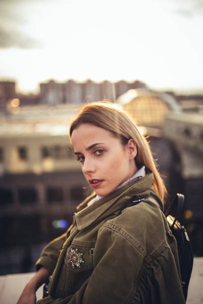 istock Beautiful young woman on the rooftop 1023683292